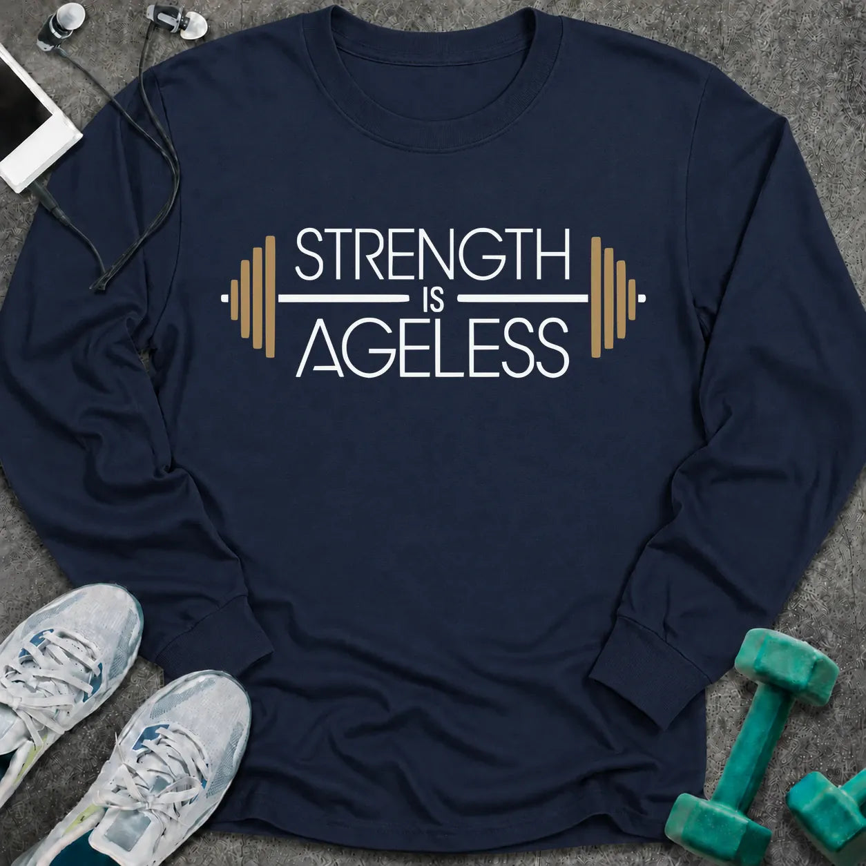Navy long sleeve tee printed with "Strength is Ageless" in white and gold, with a barbell framing the words