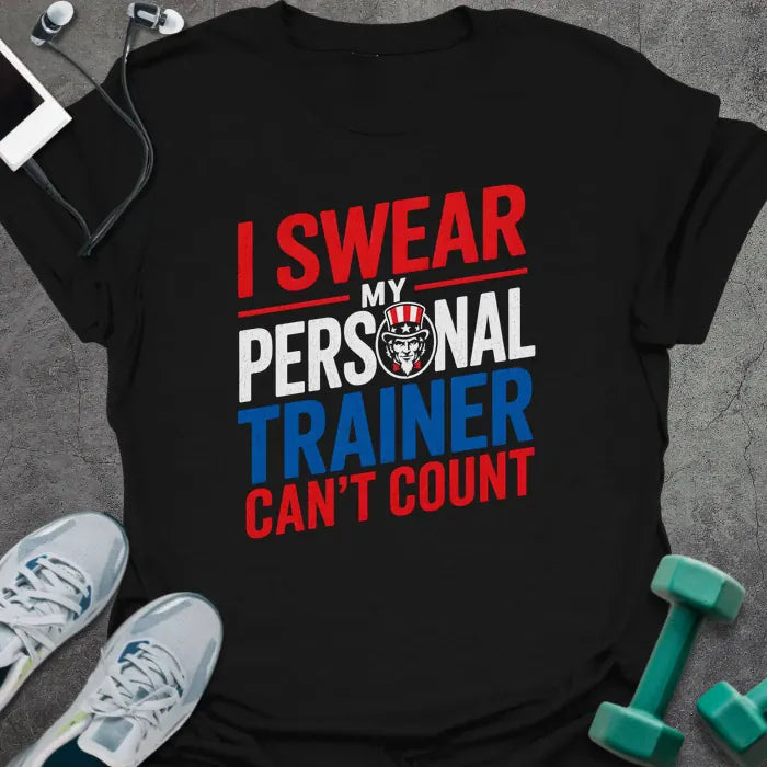 Black t-shirt printed with "I Swear my Personal Trainer Can't Count" in red, white, and blue, with bulldog icon
