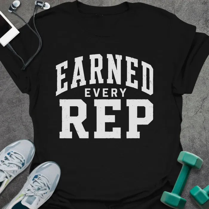 Black t-shirt printed with "Earned Every Rep" in white