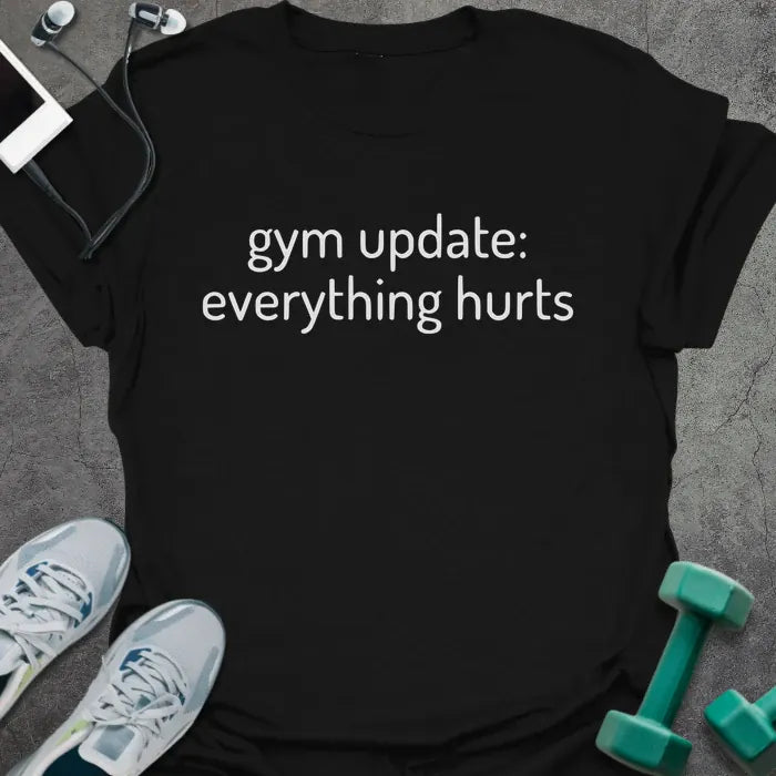 Black t-shirt printed with "gym update: everything hurts"