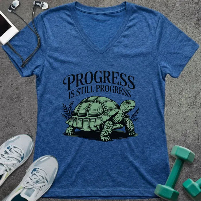 Heather true royal t-shirt printed with "Progress is Still Progress" in green, with a turtle