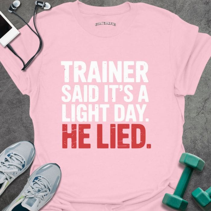 Light pink t-shirt printed with "Trainer Said It's a Light Day. He Lied." in white and red