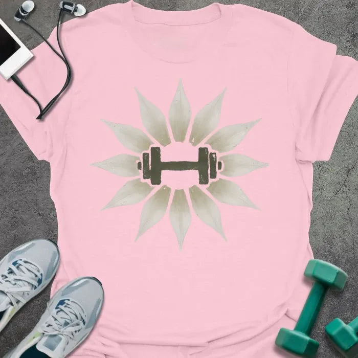 Light pink t-shirt with an illustration of lily flowers surrounding a dumbbell in white and green