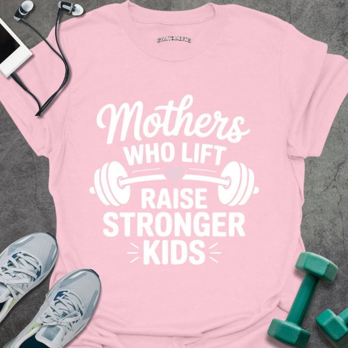 Light pink t-shirt printed with "Mothers WHO LIFT RAISE STRONGER KIDS" in white and pink, with a barbell and heart graphic