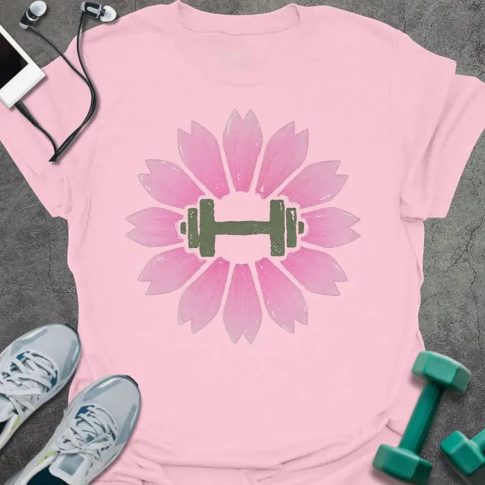 Light pink t-shirt with an illustration of pink sakura flowers surrounding a dumbbell in pink and green