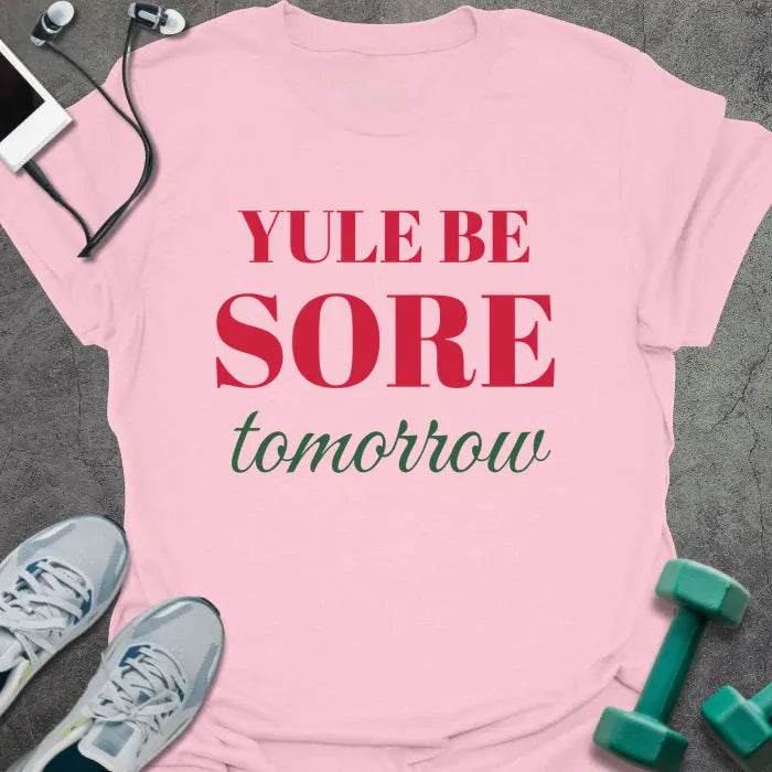 Light pink t-shirt printed with "YULE BE SORE tomorrow" in red and green