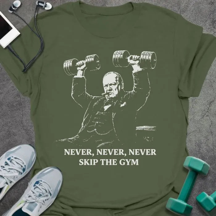 Military green t-shirt printed with "Never, Never, Never Skip the Gym" in white, with figure holding dumbbells overhead graphic