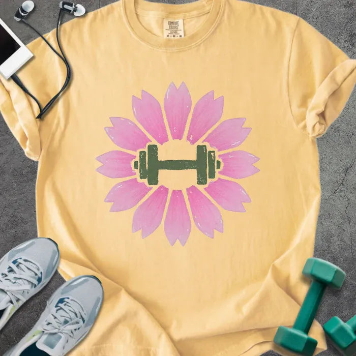 Mustard t-shirt with pink sakura flowers and barbell in center in pink and green