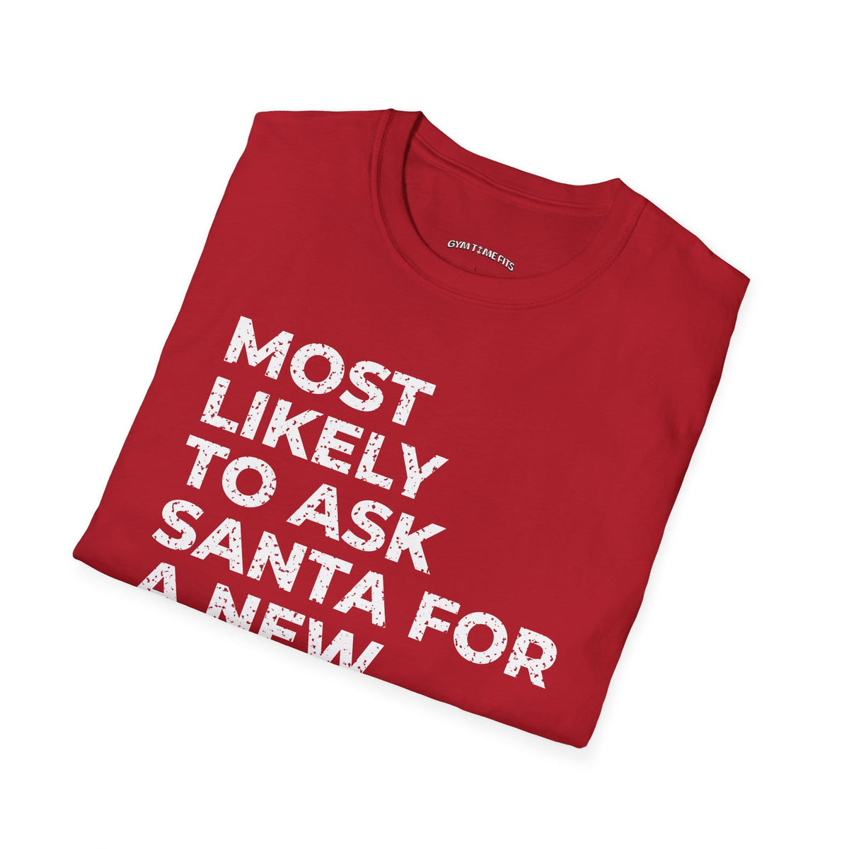 Folded cherry red t-shirt printed with "MOST LIKELY TO ASK SANTA FOR A NEW TRAINER" in white