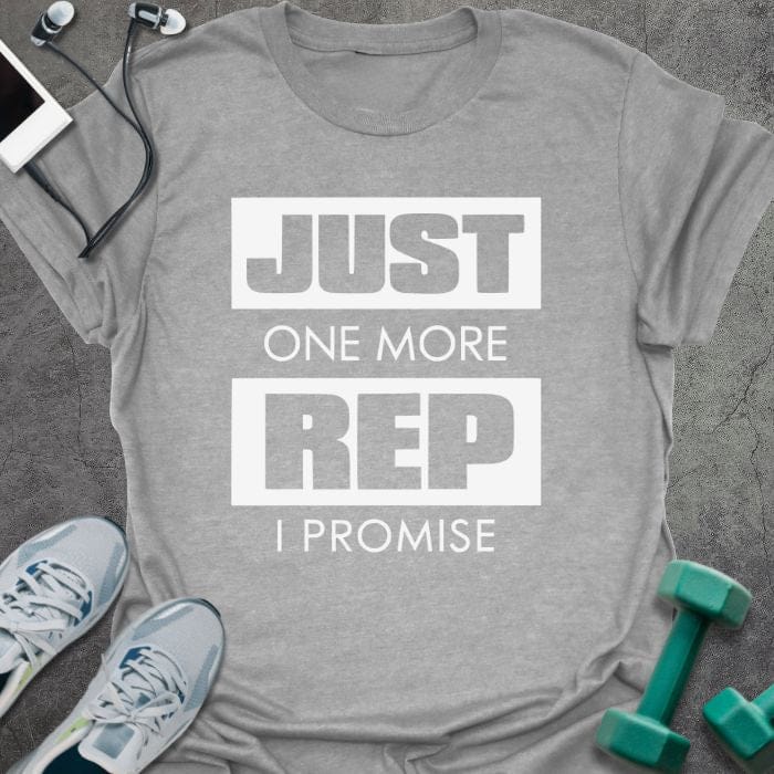 Sport grey t-shirt printed with "Just One More Rep I Promise" in white and green, with a kettlebell and dumbbell