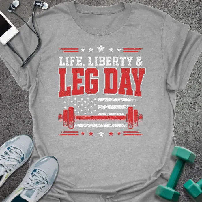 Sport grey t-shirt printed with "Life. Liberty & Legday" in white and red, with stars, a stars-and-stripes flag, and a barbell