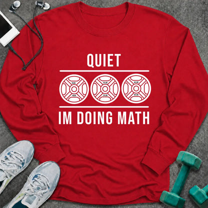 Red long sleeve tee printed with "Quiet I'm Doing Math" in white, with three weight plates