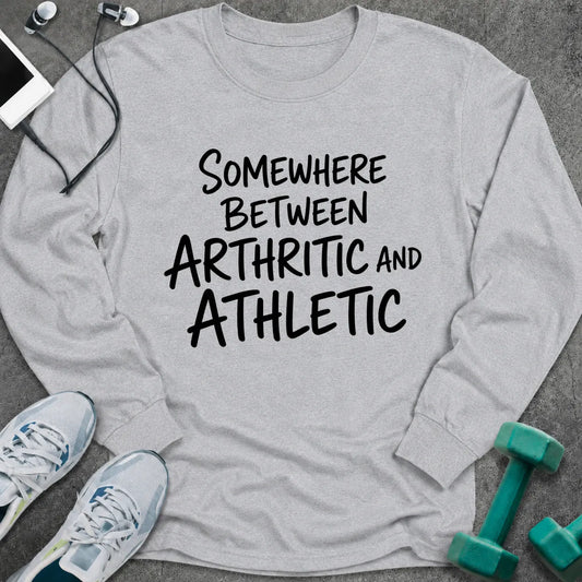 Ash long sleeve tee printed with "Somewhere Between Arthritic and Athletic" in black handwritten lettering