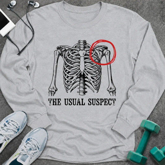 Ash long sleeve tee printed with "The Usual Suspect" in black, with a skeleton ribcage with one shoulder circled in red
