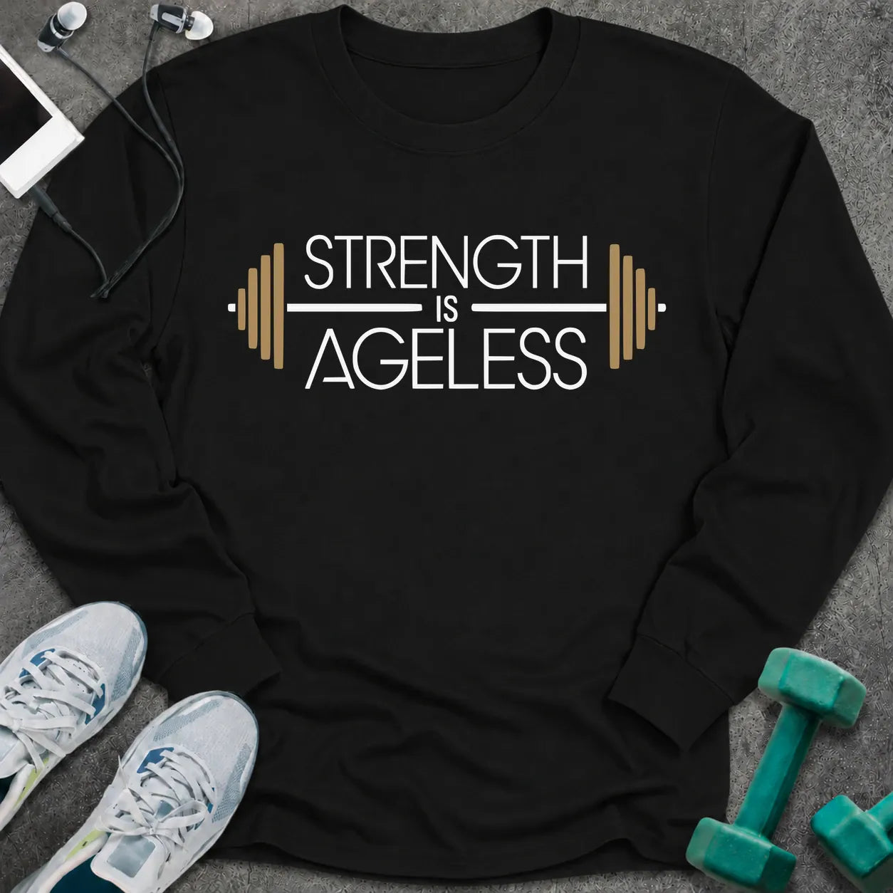 Black long sleeve tee printed with "Strength is Ageless" in white and gold, with a barbell framing the words