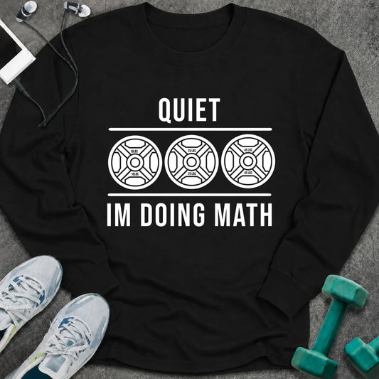 Black long sleeve tee printed with "Quiet I'm Doing Math" in white, with three weight plates