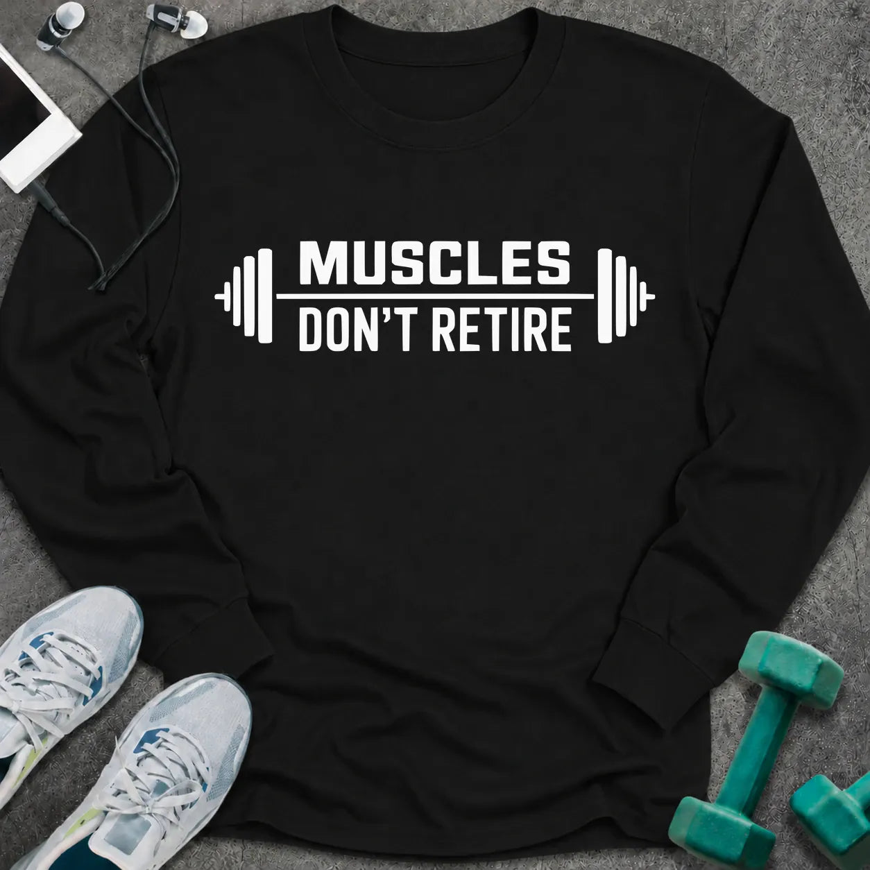 Black long sleeve tee printed with "Muscles Don't Retire" in white, with barbells on either side