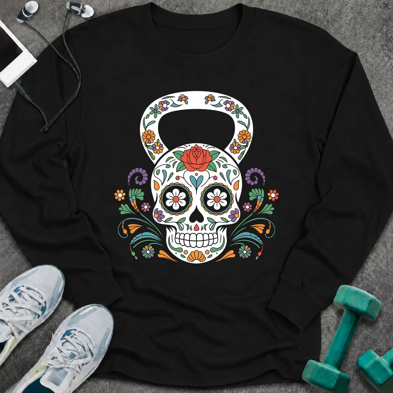 Black long sleeve tee printed with a sugar skull kettlebell covered in colorful flowers