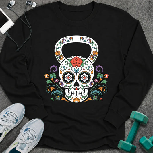 Black long sleeve tee printed with a sugar skull kettlebell covered in colorful flowers