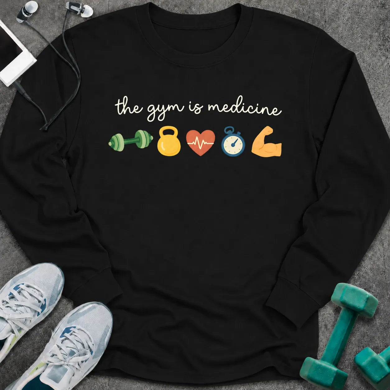 Black long sleeve tee printed with "the gym is medicine" in white script, with dumbbell, kettlebell, heart, stopwatch and flexed arm icons