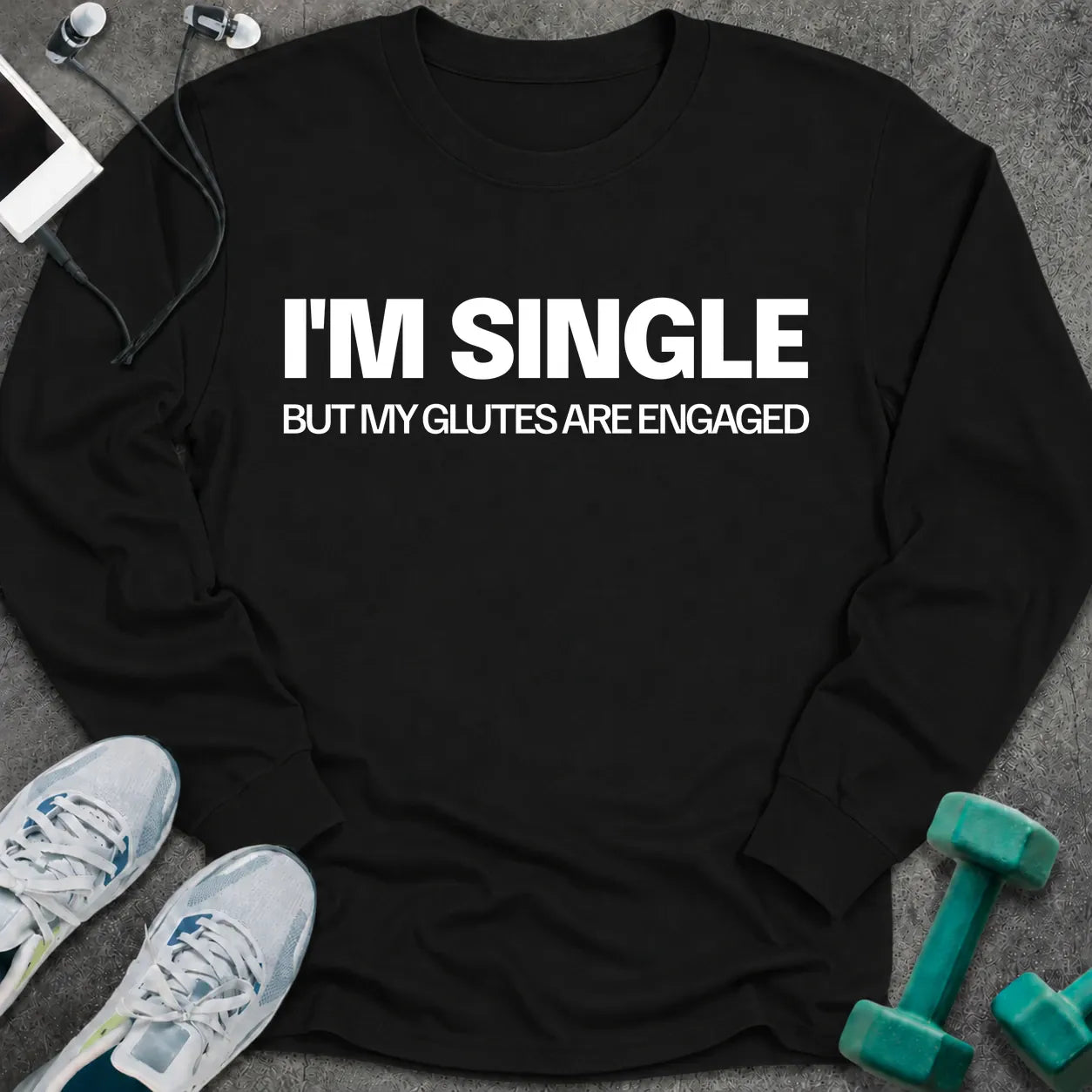 Black long sleeve tee printed with "I'm Single But My Glutes Are Engaged" in white