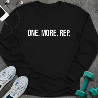 Black long sleeve tee printed with "One. More. Rep." in white