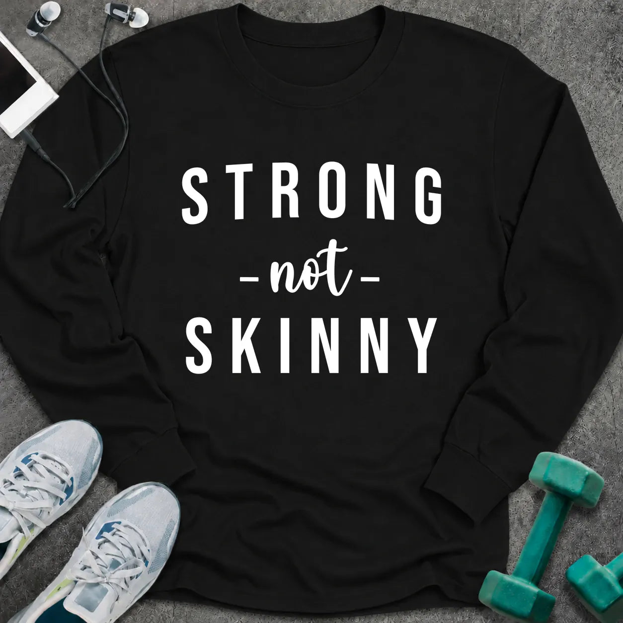 Black long sleeve tee printed with "Strong Not Skinny" in white
