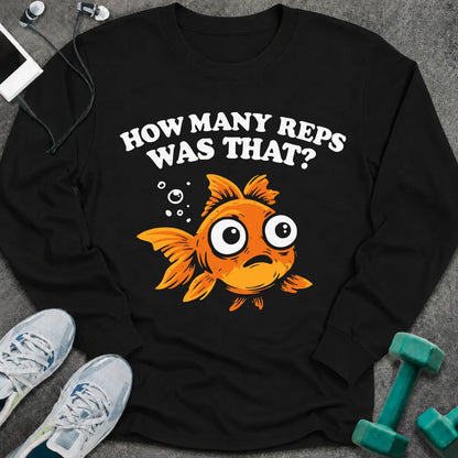 Black long sleeve tee printed with "How Many Reps Was That?" in white, with a wide-eyed goldfish