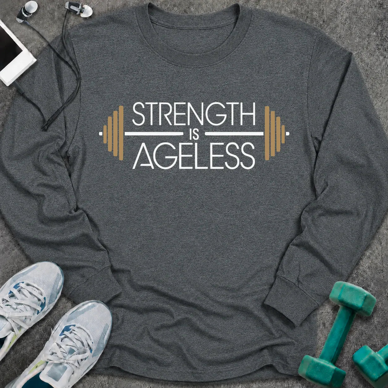 Dark heather long sleeve tee printed with "Strength is Ageless" in white and gold, with a barbell framing the words