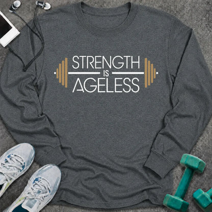 Dark heather long sleeve tee printed with "Strength is Ageless" in white and gold, with a barbell framing the words