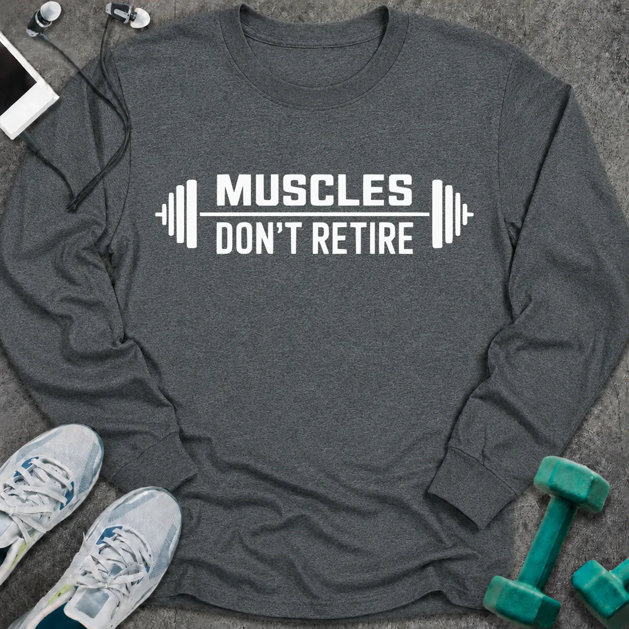 Dark heather long sleeve tee printed with "Muscles Don't Retire" in white, with barbells on either side