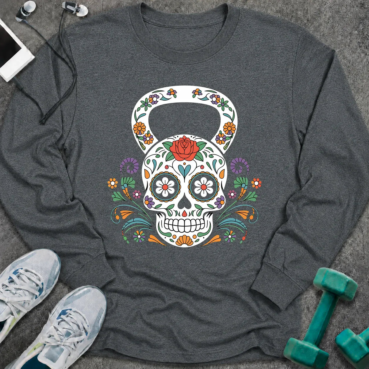 Dark heather long sleeve tee printed with a sugar skull kettlebell covered in colorful flowers