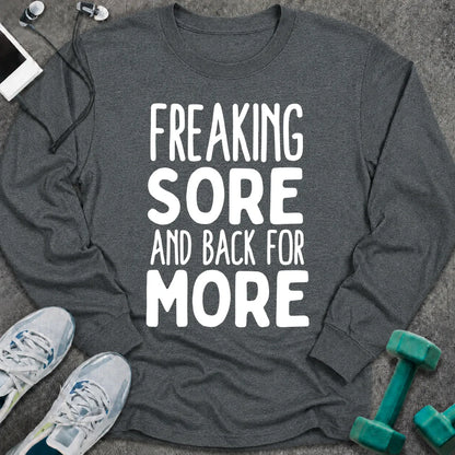 Dark heather long sleeve tee printed with "Freaking Sore And Back For More" in white