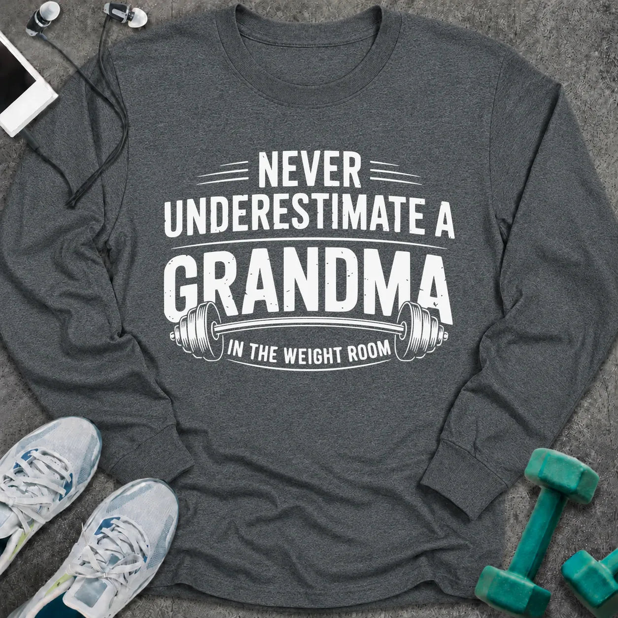Dark heather long sleeve tee printed with "Never Underestimate A Grandma In The Weight Room" in white, with a barbell