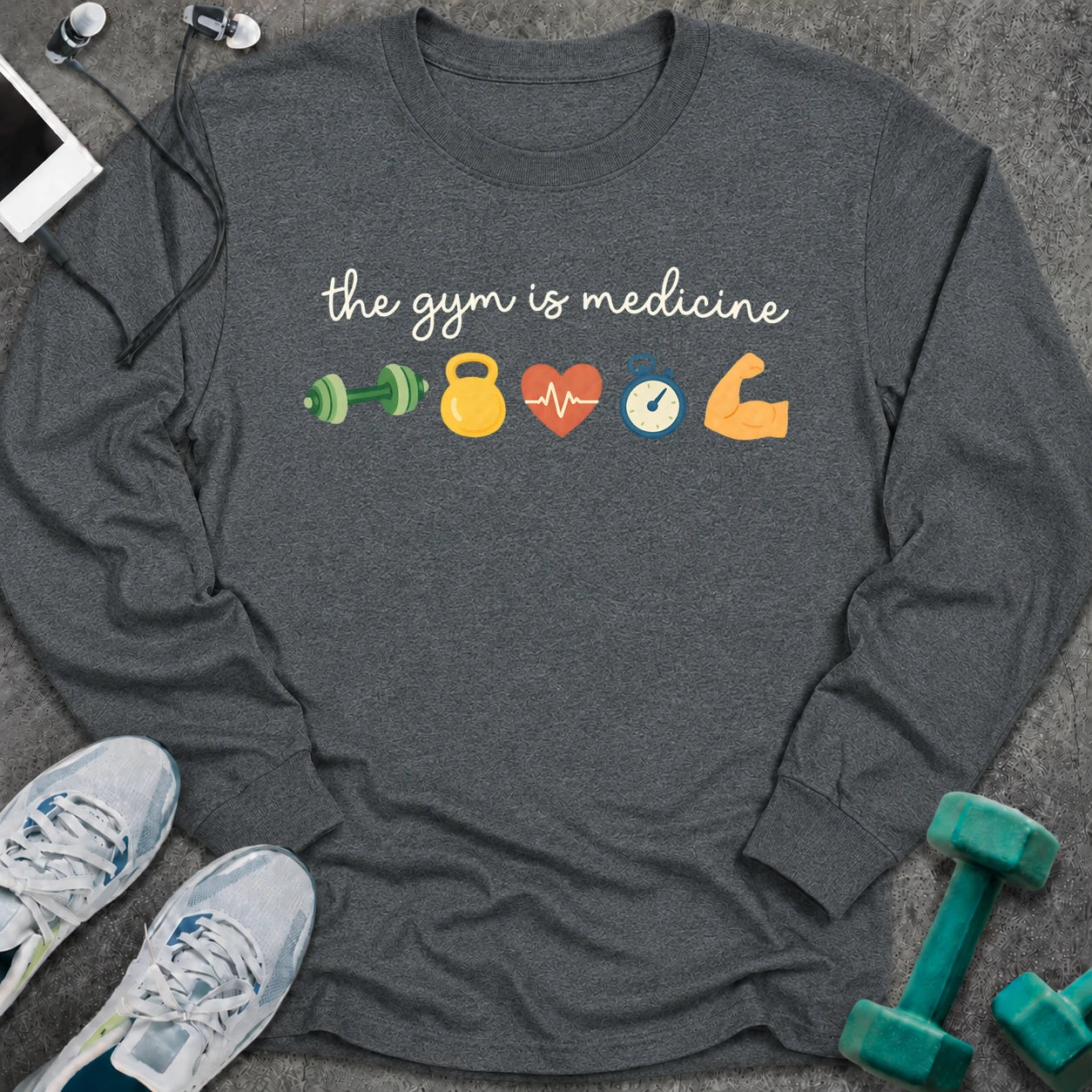 Dark heather long sleeve tee printed with "the gym is medicine" in white script, with dumbbell, kettlebell, heart, stopwatch and flexed arm icons