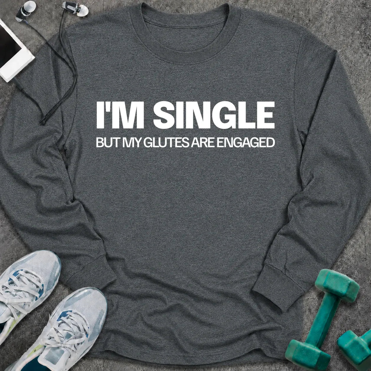 Dark heather long sleeve tee printed with "I'm Single But My Glutes Are Engaged" in white