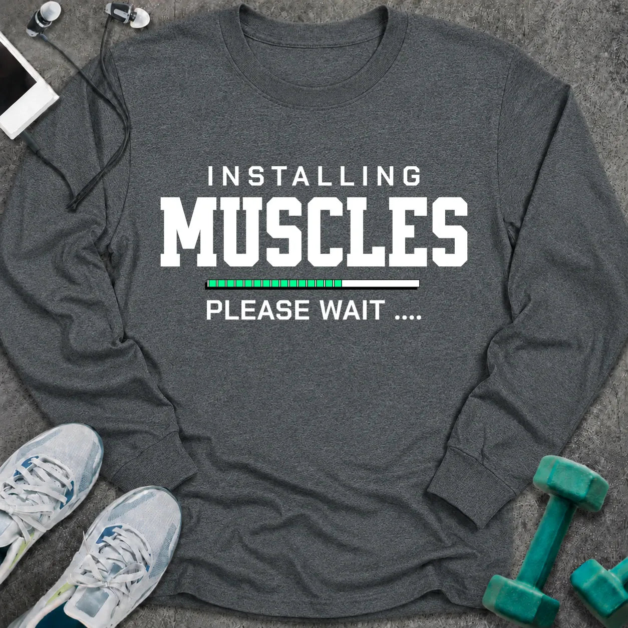 Dark heather long sleeve tee printed with "Installing Muscles Please Wait" in white, with a green loading bar