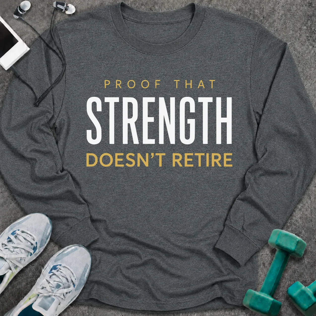 Dark heather long sleeve tee printed with "Proof That Strength Doesn't Retire" in white and gold