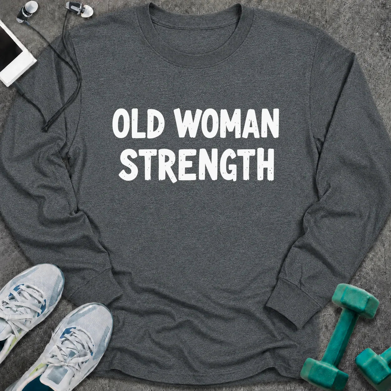 Dark heather long sleeve tee printed with "Old Woman Strength" in white