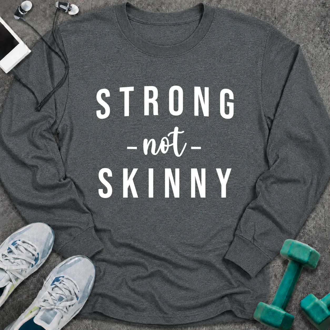 Dark heather long sleeve tee printed with "Strong Not Skinny" in white