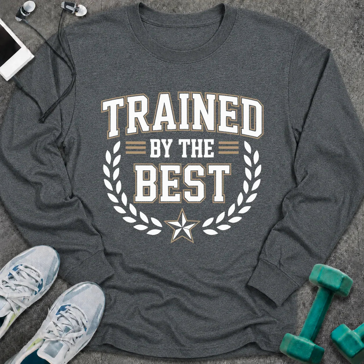 Dark heather long sleeve tee printed with "Trained By The Best" in white, with a laurel wreath and star