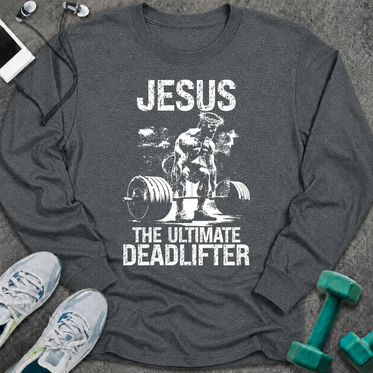 Dark heather long sleeve tee printed with "Jesus The Ultimate Deadlifter" in white, with Jesus pulling a loaded barbell
