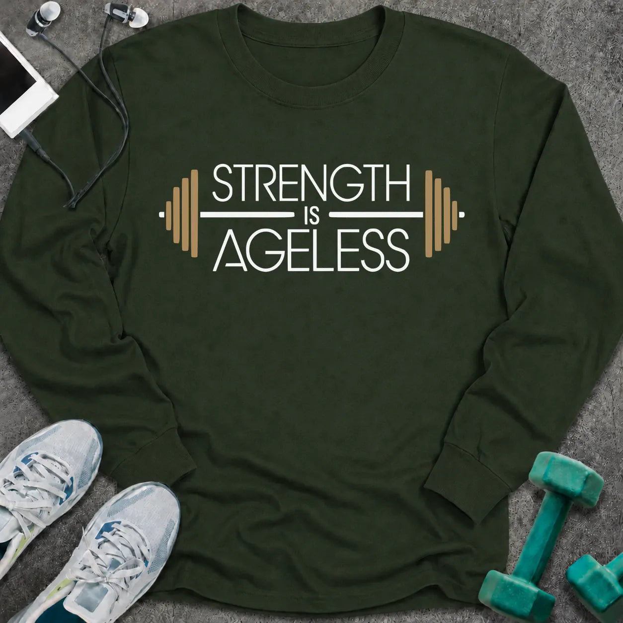 Forest green long sleeve tee printed with "Strength is Ageless" in white and gold, with a barbell framing the words
