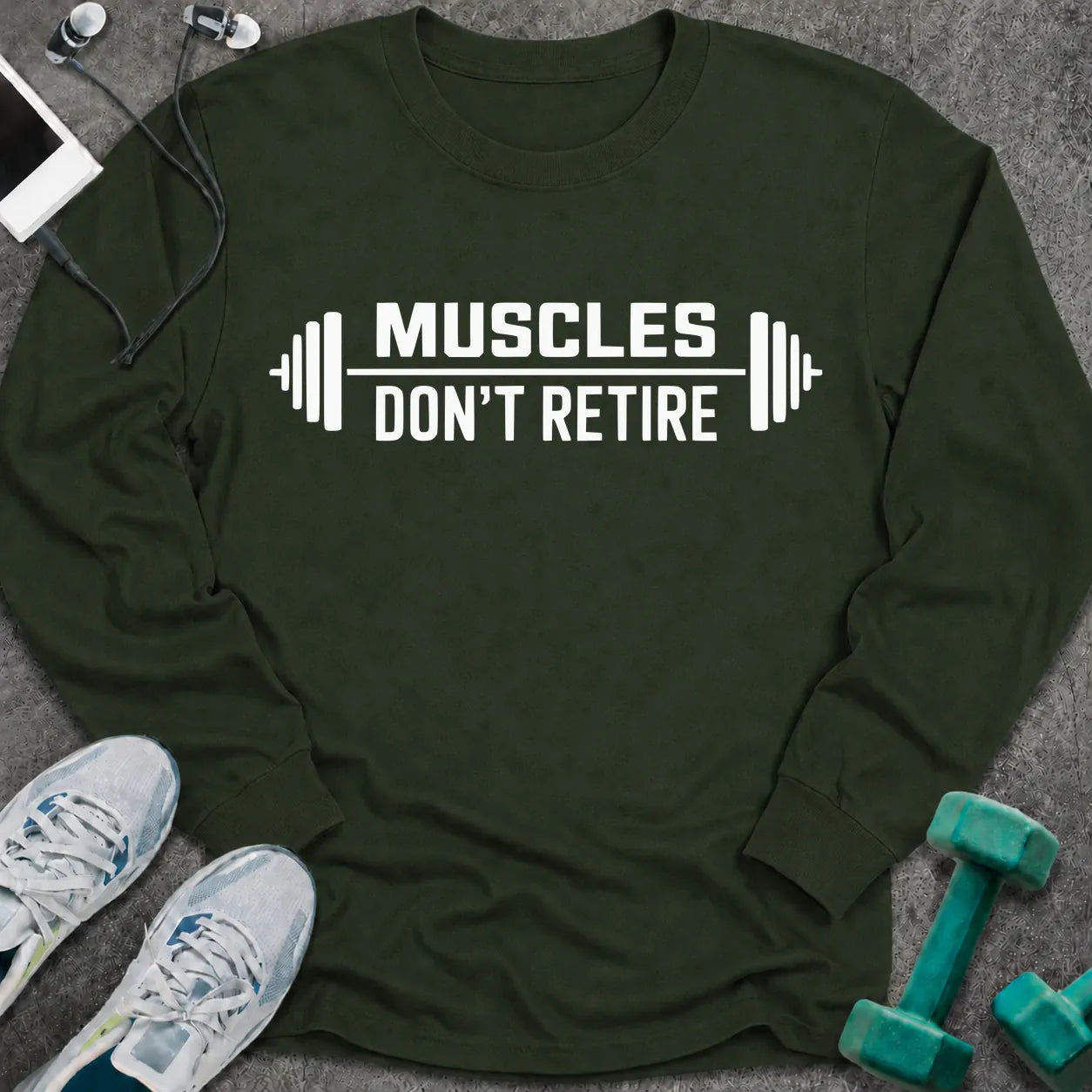 Forest green long sleeve tee printed with "Muscles Don't Retire" in white, with barbells on either side