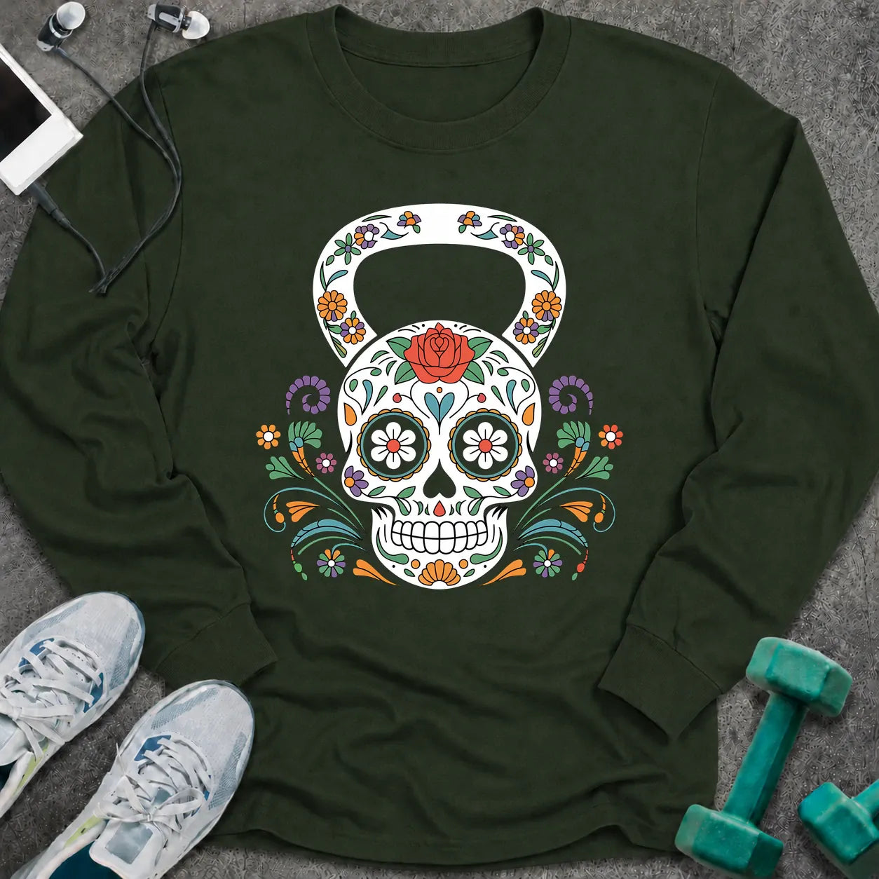 Forest green long sleeve tee printed with a sugar skull kettlebell covered in colorful flowers