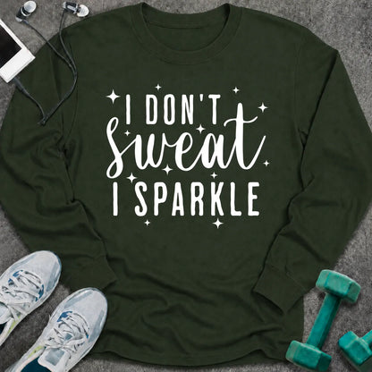 Forest green long sleeve tee printed with "I Don't Sweat I Sparkle" in white script, with sparkle stars