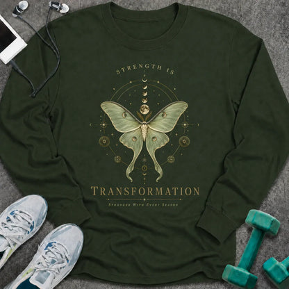 Forest green long sleeve tee printed with "Strength Is Transformation" in gold, with a luna moth beneath a row of moon phases