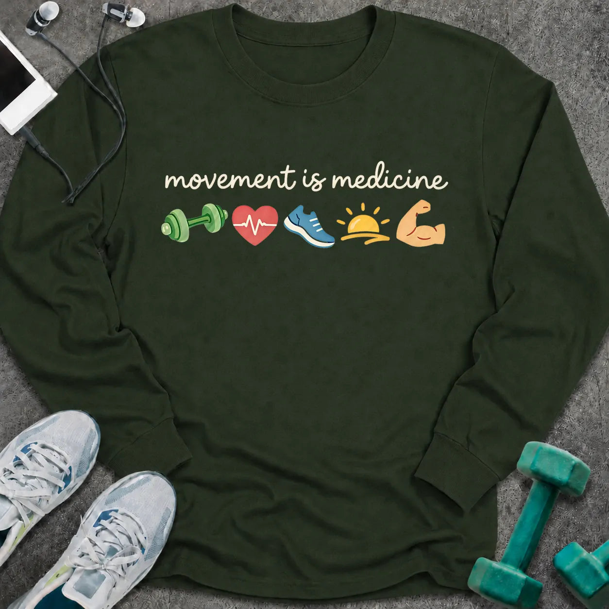 Forest green long sleeve tee printed with "movement is medicine" in white script, with dumbbell, heart, running shoe, sunrise and flexed arm icons