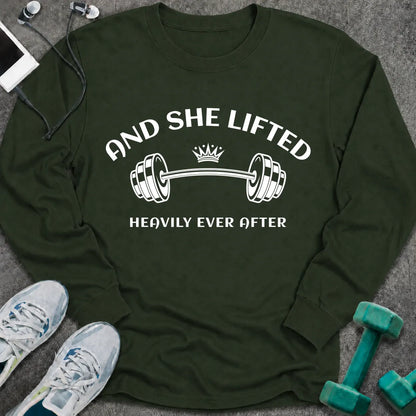 Forest green long sleeve tee printed with "And She Lifted Heavily Ever After" in white, with a barbell topped with a crown