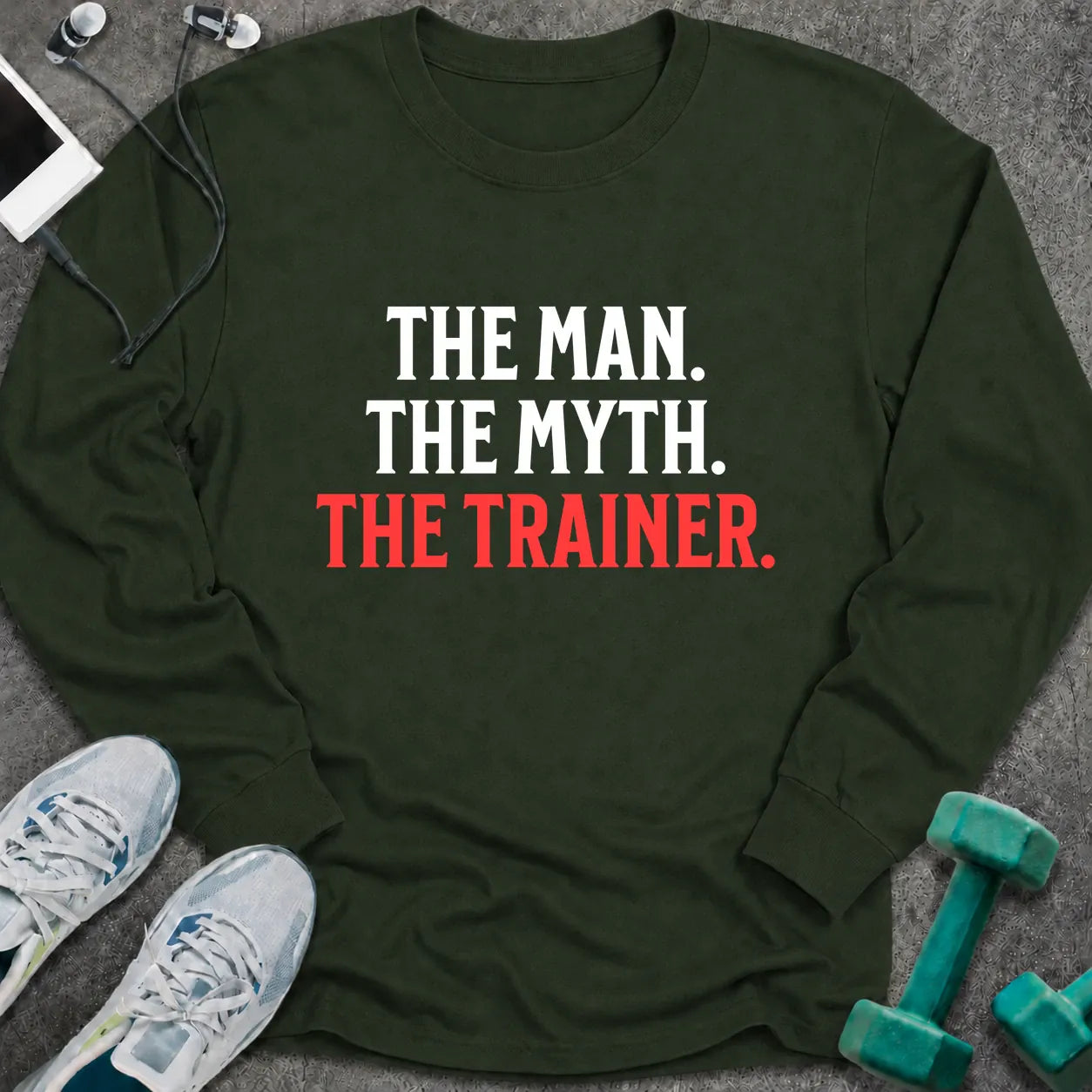 Forest green long sleeve tee printed with "The Man. The Myth. The Trainer." in white and coral